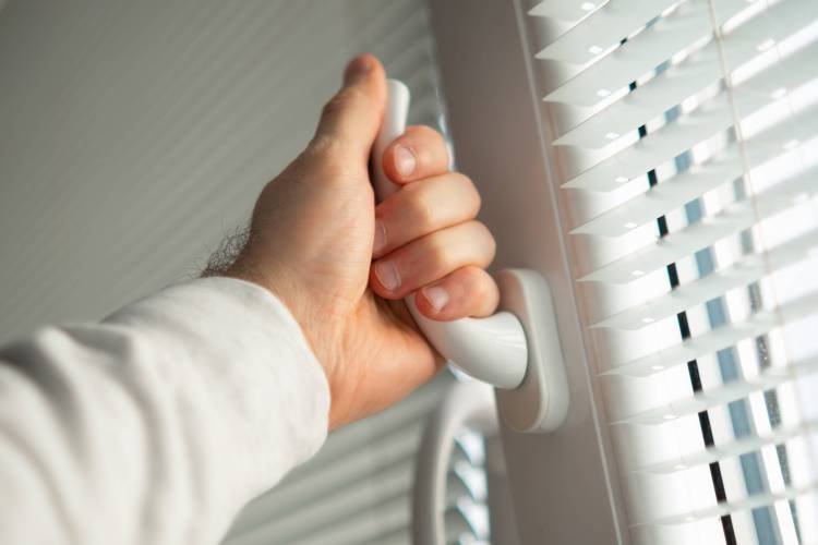 Close up man hand open a window for ventilation of the home.